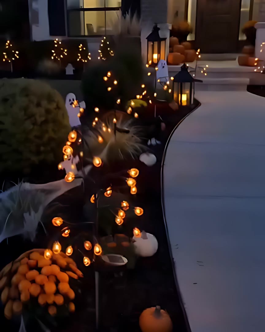 The same flower bed glowing after dark