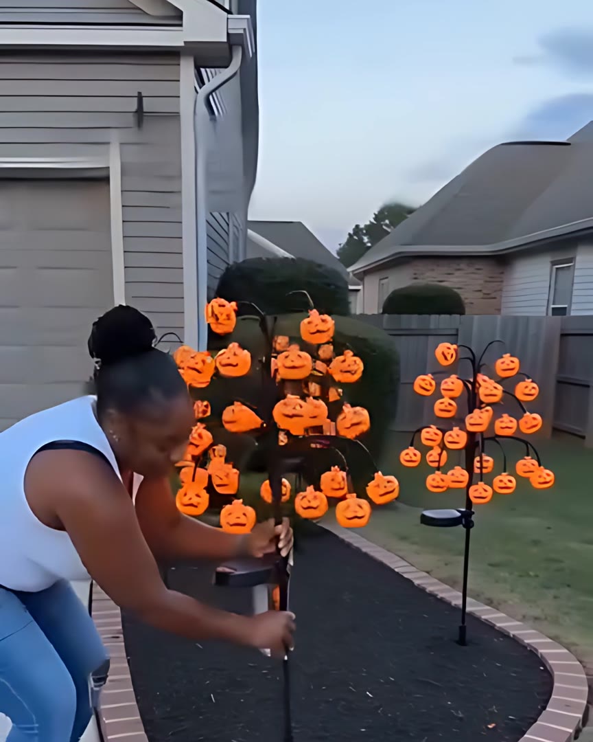 Pushing the stake into a flower bed